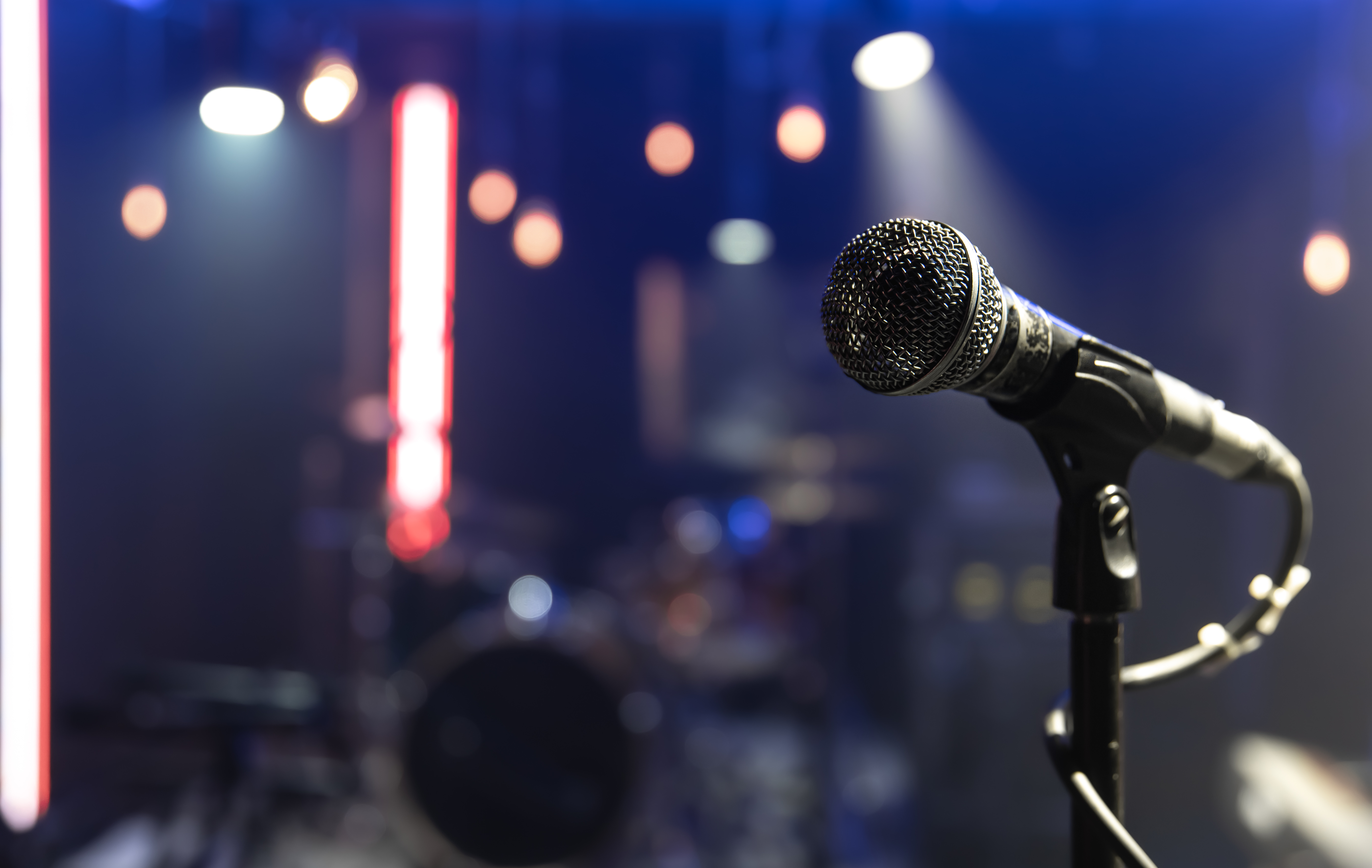 Close up microphone on blurred background with bokeh.