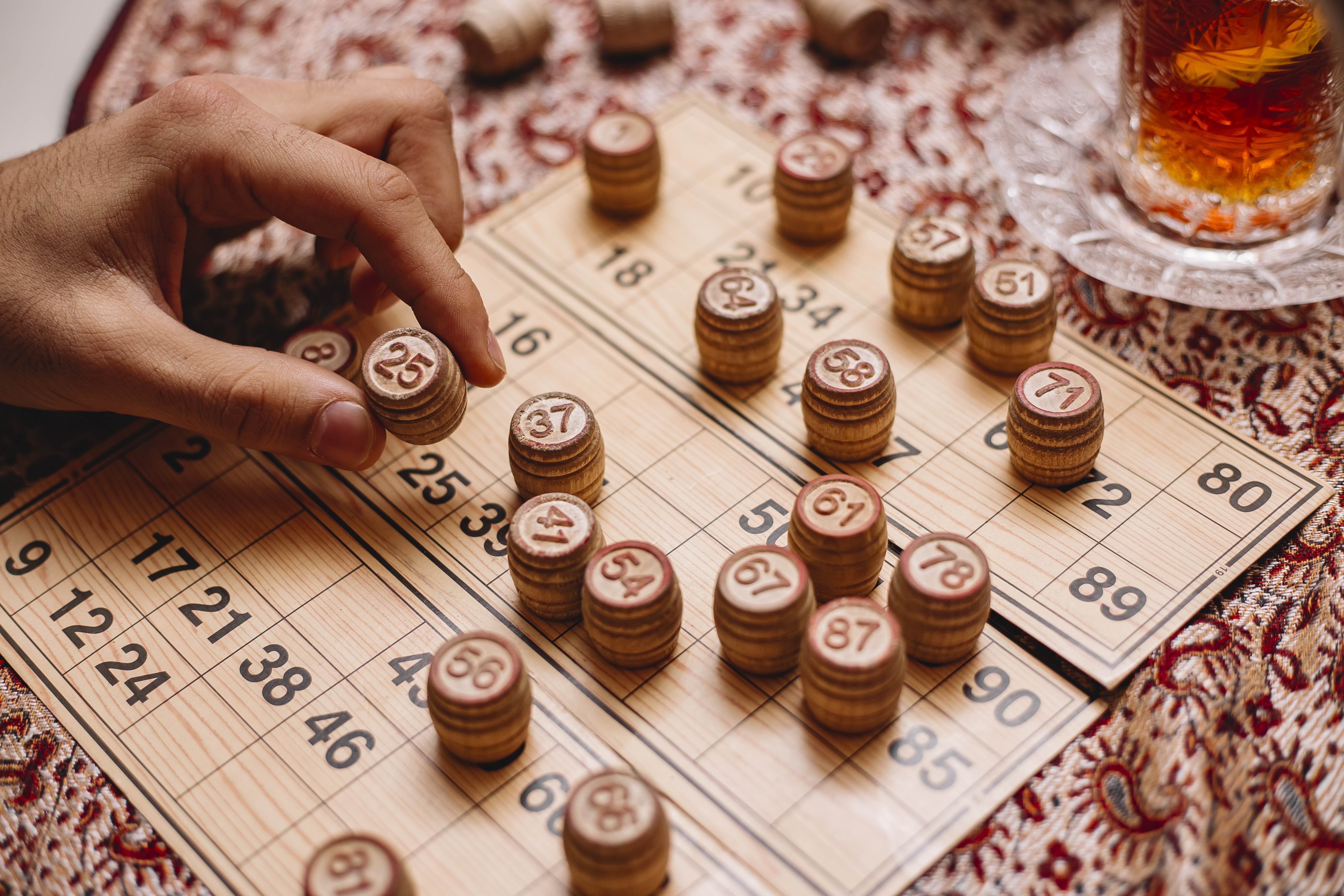 loto game man puts number tea side view