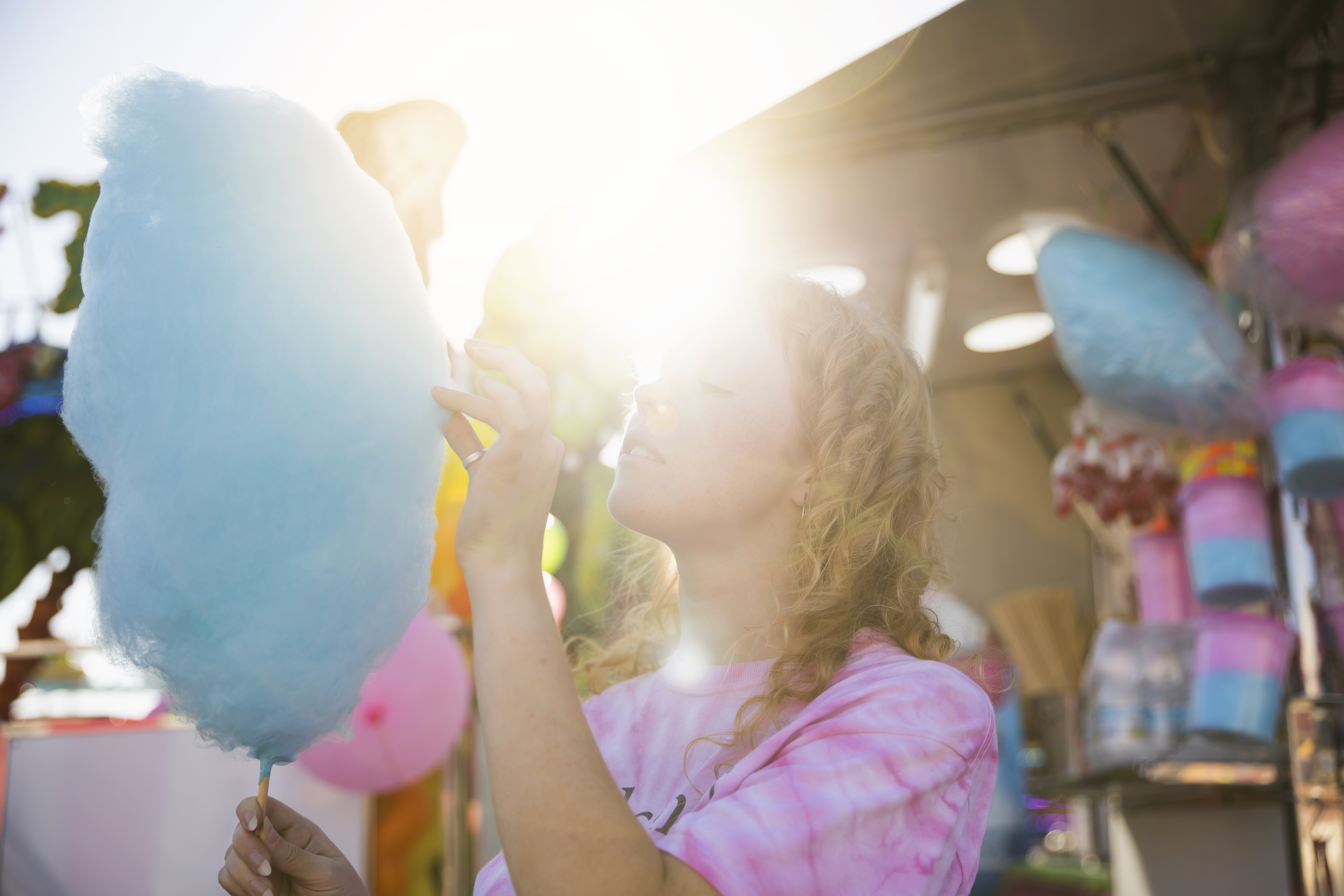 portrait-beautiful-woman-eating-cotton-candy