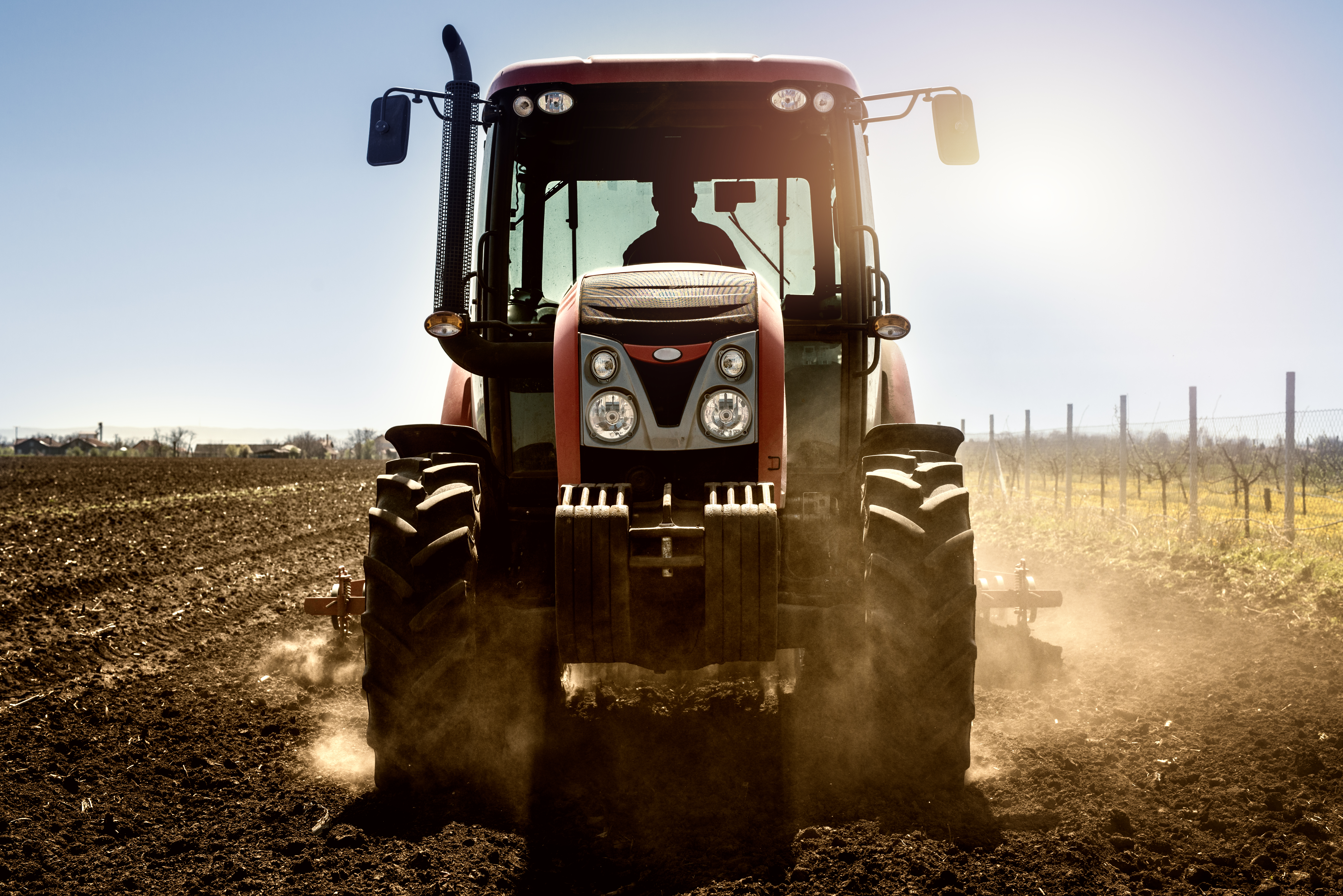 Tractor agricultural machine working in the field.
